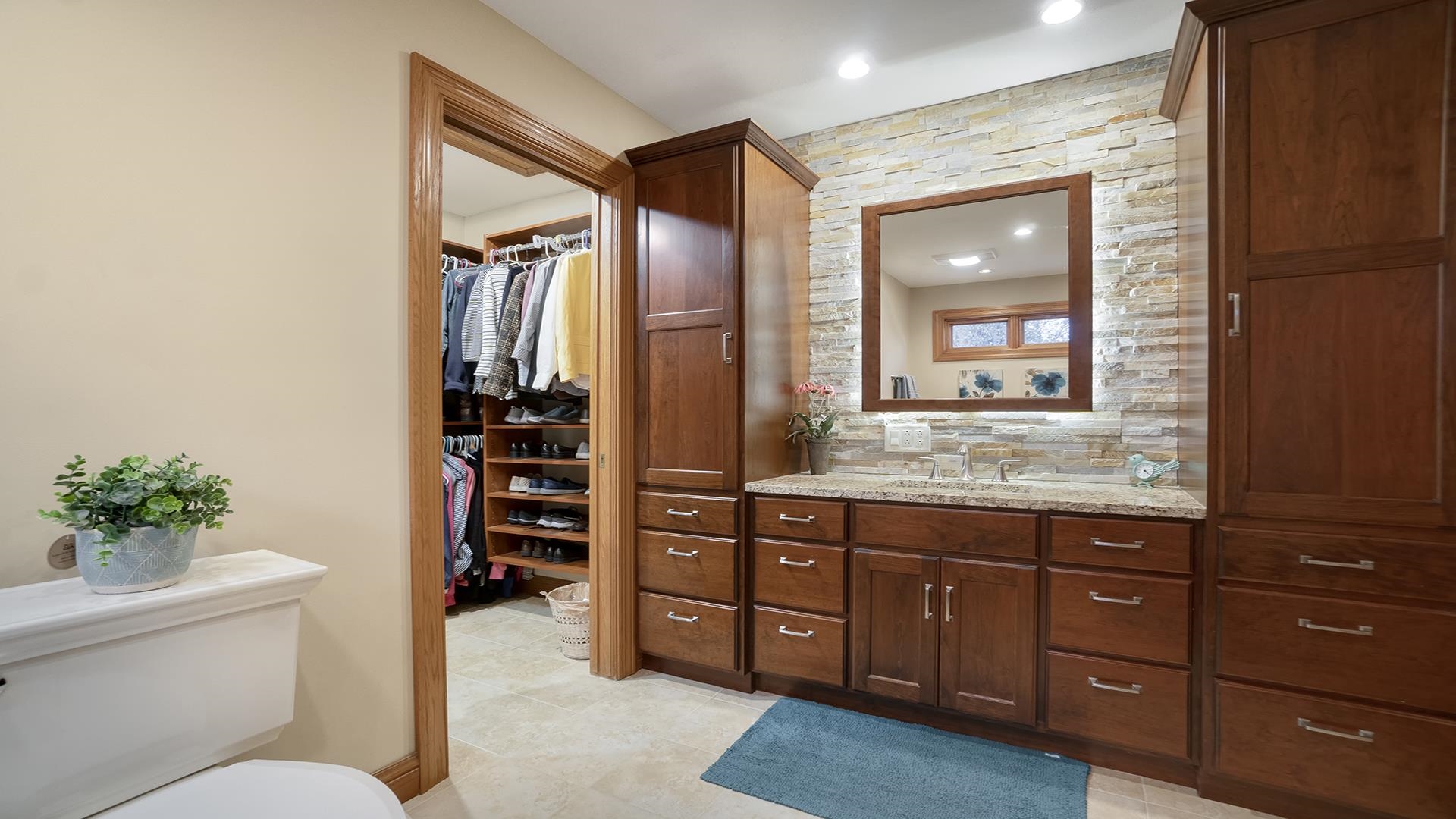 1921 Wildcat Road Dixon, IL 61021 - Photo 26 of 63 a bathroom with a granite countertop sink a mirror a vanity and a bathtub