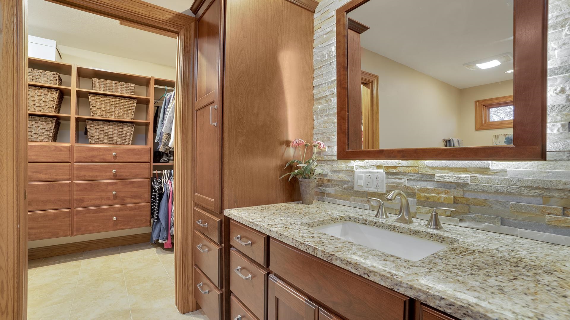 1921 Wildcat Road Dixon, IL 61021 - Photo 28 of 63 a bathroom with a granite countertop sink and a mirror