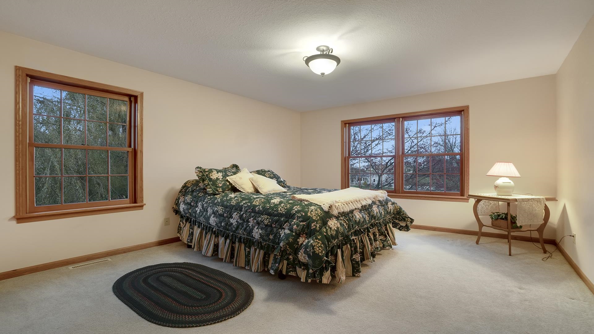 1921 Wildcat Road Dixon, IL 61021 - Photo 34 of 63 a bed sitting in a bedroom next to a window