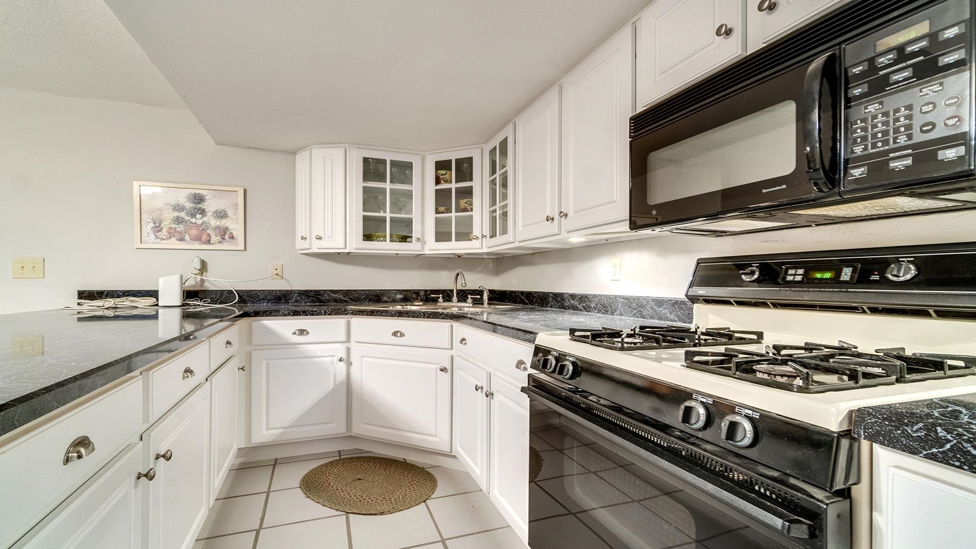 1921 Wildcat Road Dixon, IL 61021 - Photo 37 of 63 a kitchen with granite countertop cabinets stainless steel appliances and a sink