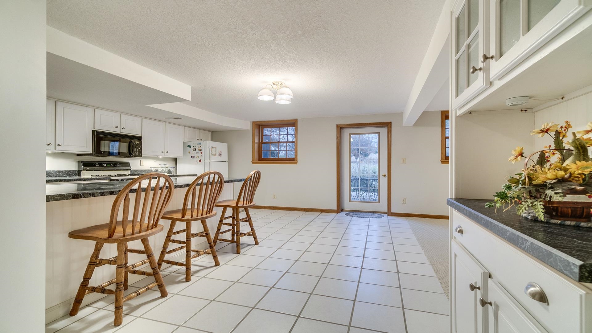 1921 Wildcat Road Dixon, IL 61021 - Photo 38 of 63 a view of a kitchen with furniture and wooden floor
