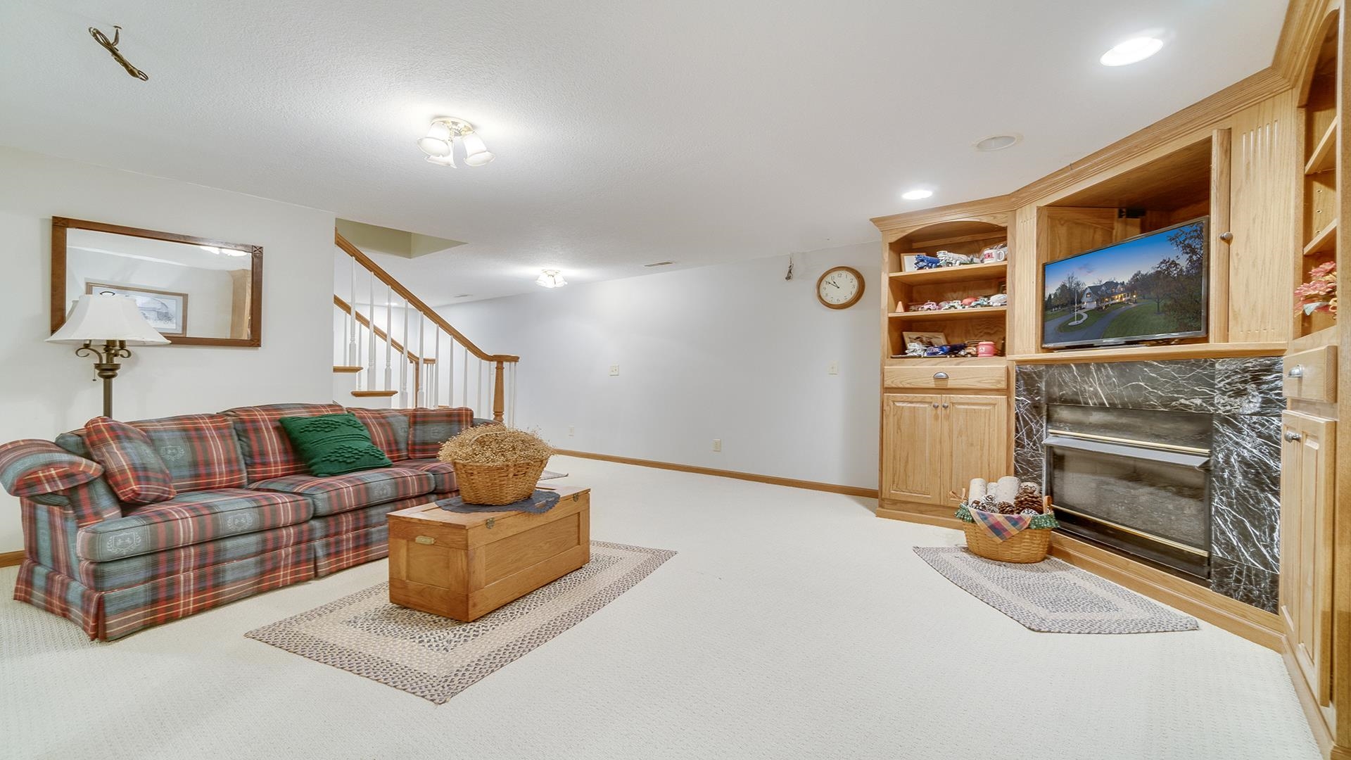 1921 Wildcat Road Dixon, IL 61021 - Photo 40 of 63 a living room with furniture gym equipment and a flat screen tv