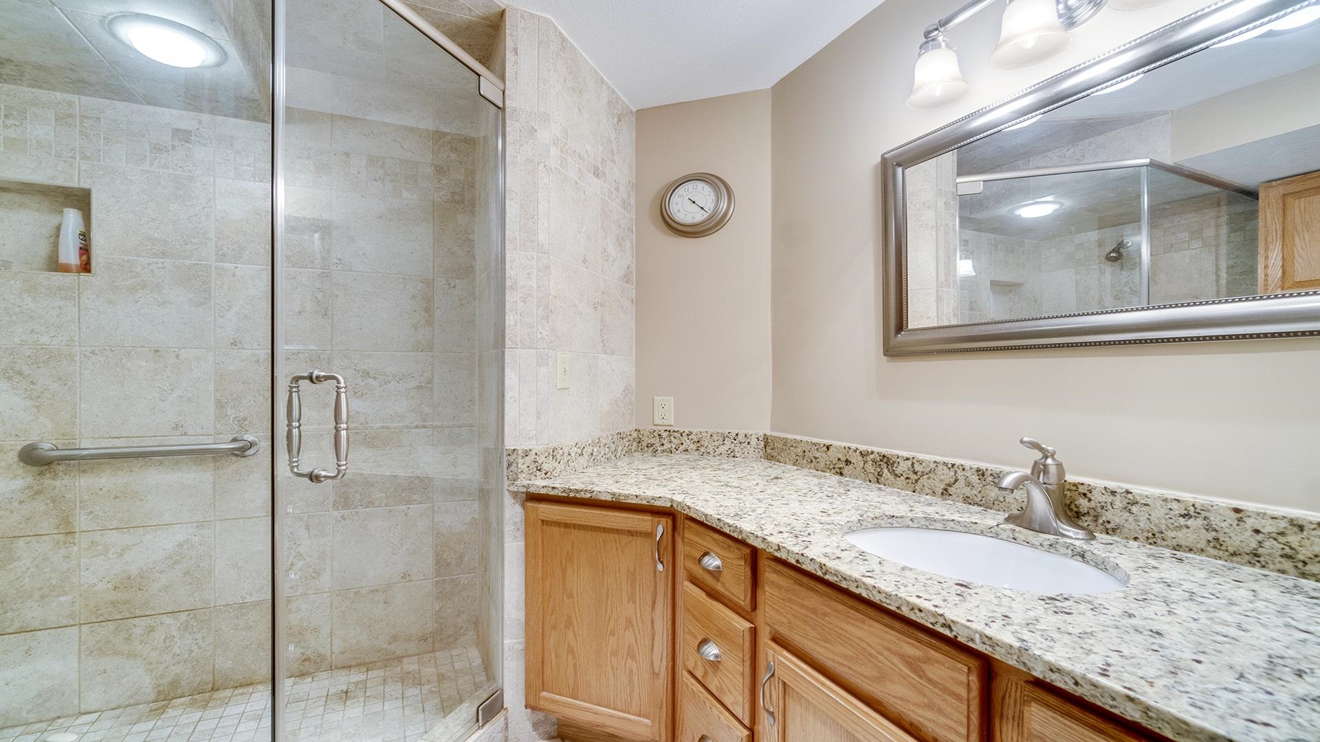 1921 Wildcat Road Dixon, IL 61021 - Photo 42 of 63 a bathroom with a granite countertop sink and mirror