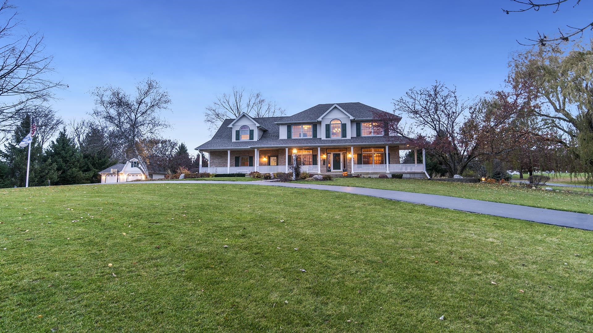 1921 Wildcat Road Dixon, IL 61021 - Photo 57 of 63 a front view of house with yard and tree in the background