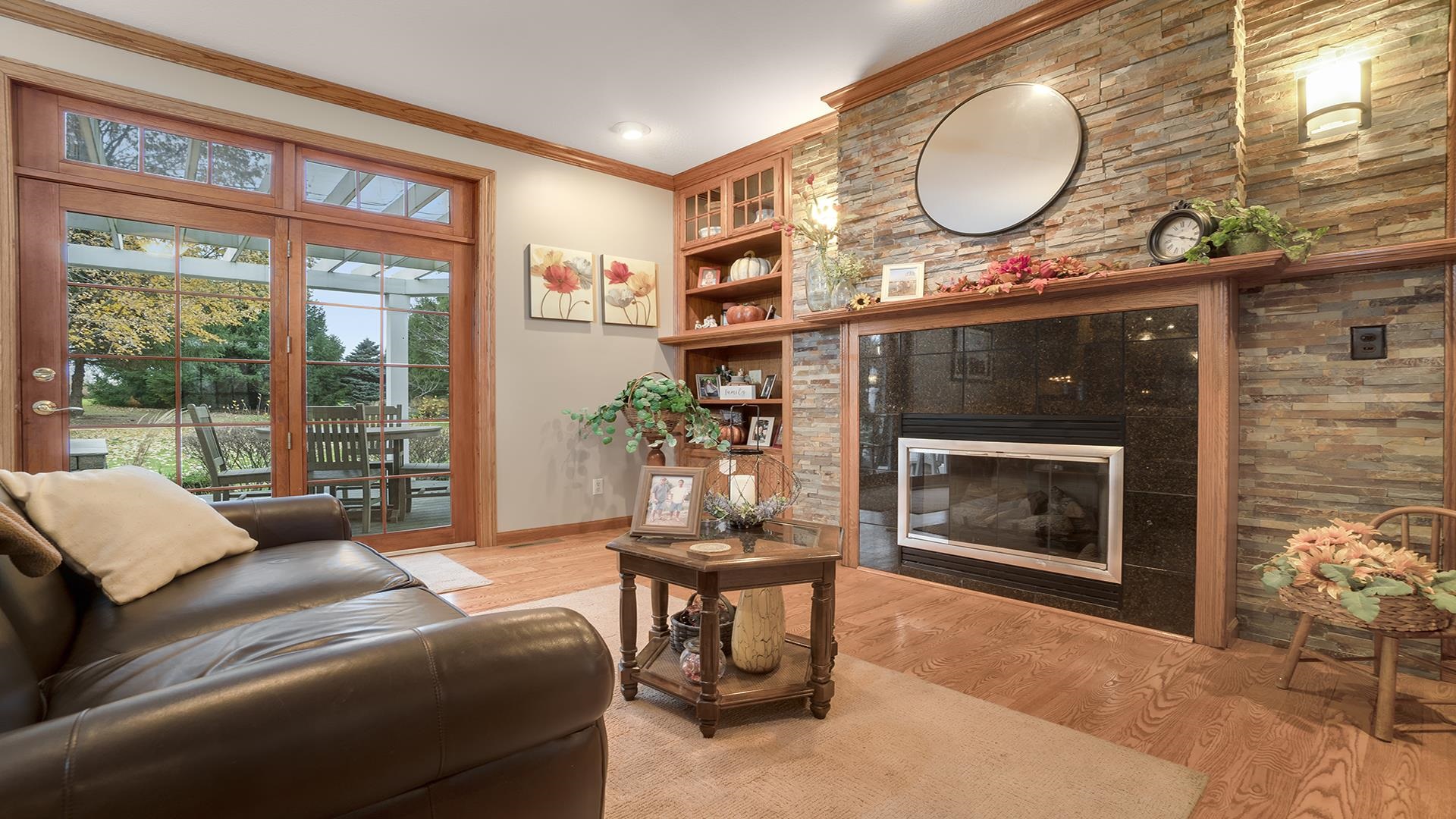 1921 Wildcat Road Dixon, IL 61021 - Photo 9 of 63 a living room with furniture a fireplace and a large window