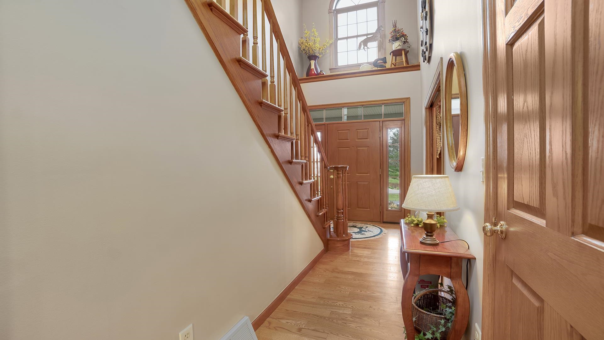 1921 Wildcat Road Dixon, IL 61021 - Photo 10 of 63 a view of a hallway with wooden floor and staircase