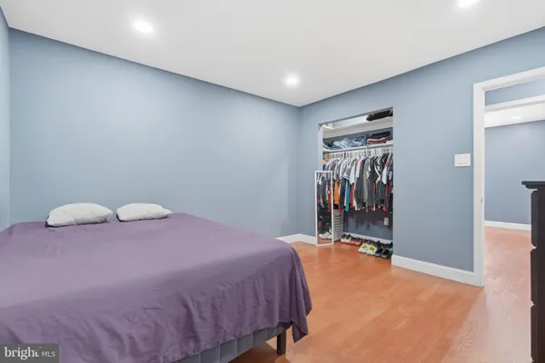 a bedroom with a bed and a view of bathroom