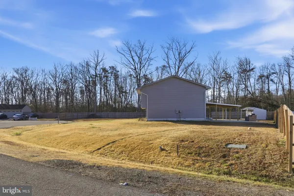 a house with yard in front of it