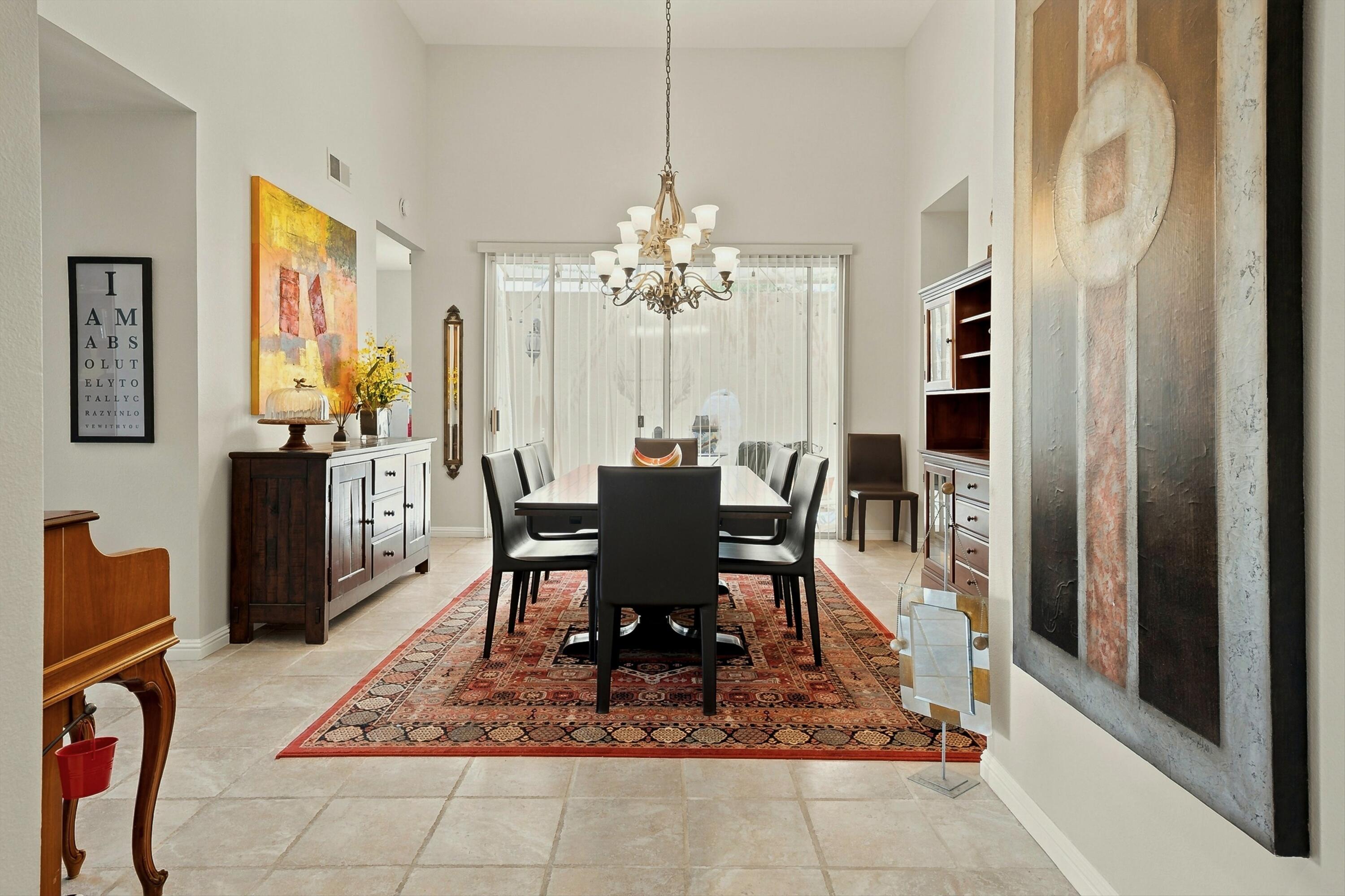138 Lakeshore Drive Rancho Mirage, CA 92270 - Photo 3 of 30 a view of a dining room with furniture window and wooden floor