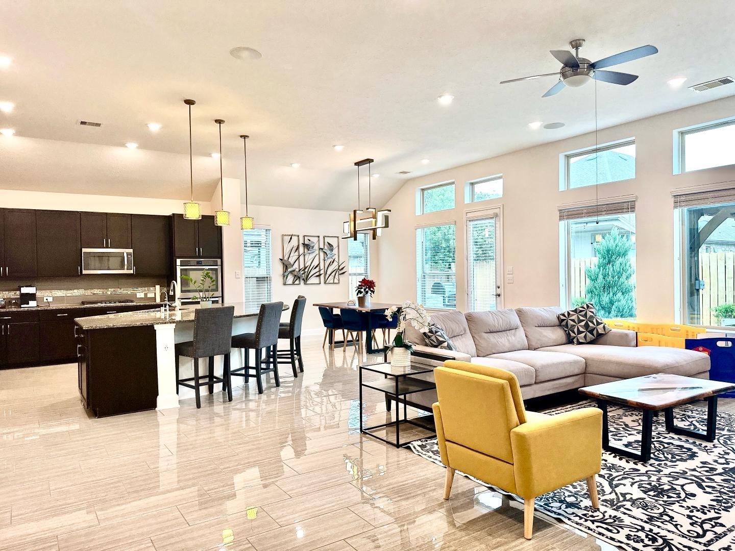 1110 Penny Ranch Lane Katy, TX 77494 - Photo 13 of 31 a living room with furniture kitchen view and a large window