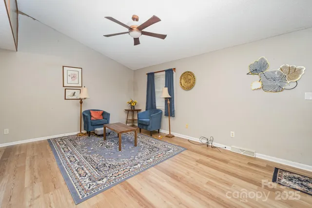 a work room with furniture and rug