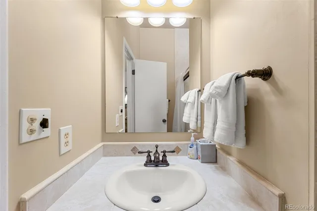 a bathroom with a sink and a mirror