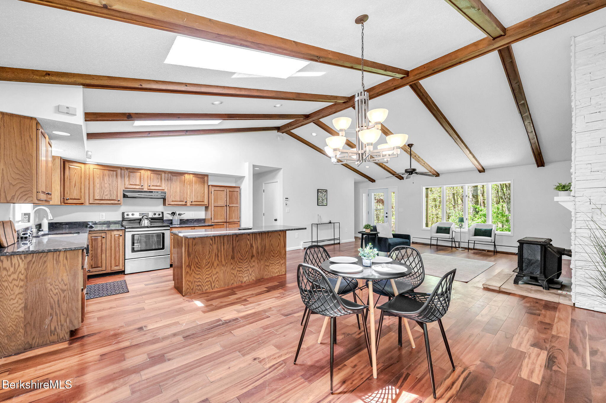 1874 Home Road Sheffield, MA 01230 - Photo 17 of 42 a kitchen with stainless steel appliances granite countertop wooden floors and couches