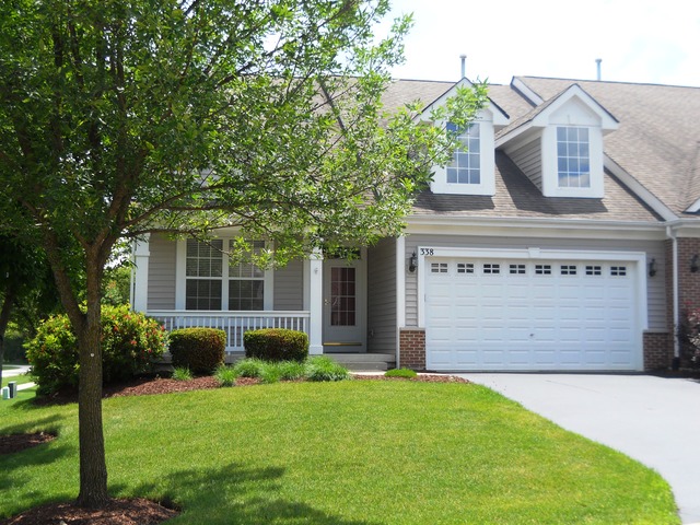 338 Quarry Ridge Circle Sugar Grove, IL 60554 - Photo 1 of 22 a front view of a house with garden