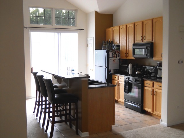 338 Quarry Ridge Circle Sugar Grove, IL 60554 - Photo 6 of 22 a kitchen with stainless steel appliances granite countertop a refrigerator and a stove top oven