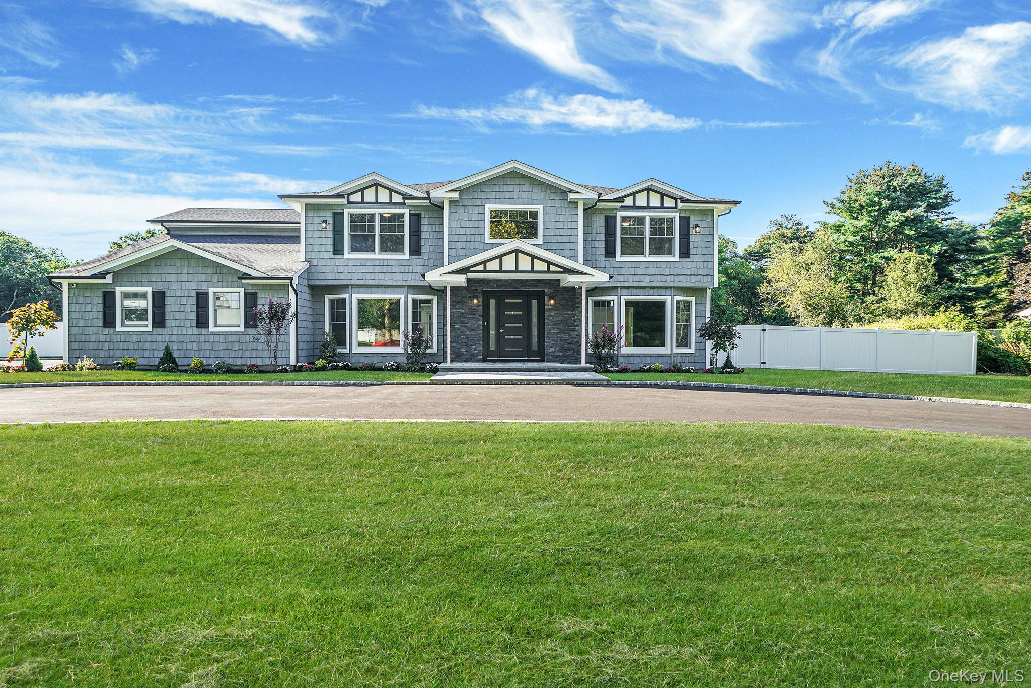 14 Quintree Lane Melville, NY 11747 - Photo 1 of 46 a front view of a house with a yard