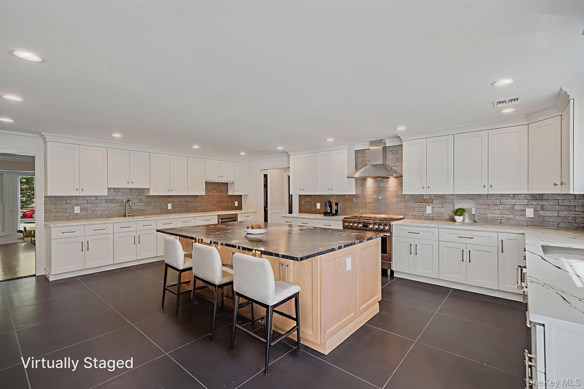 14 Quintree Lane Melville, NY 11747 - Photo 14 of 46 a kitchen with stainless steel appliances granite countertop a sink and cabinets