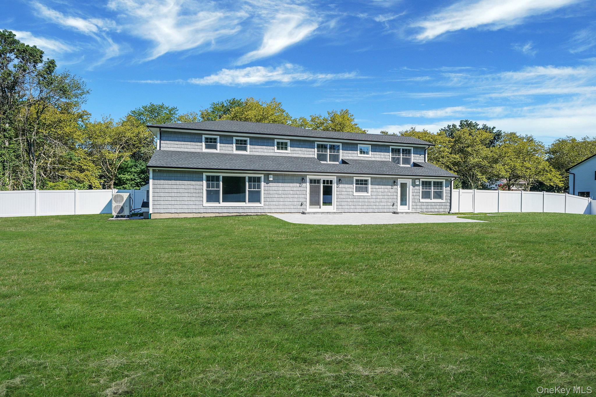 14 Quintree Lane Melville, NY 11747 - Photo 2 of 46 a front view of a house with a garden