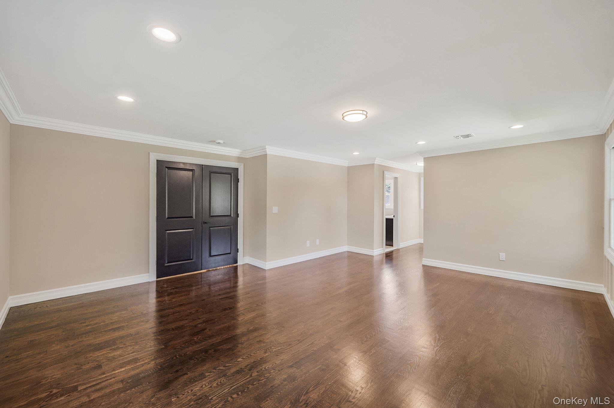 14 Quintree Lane Melville, NY 11747 - Photo 29 of 46 a view of empty room with wooden floor