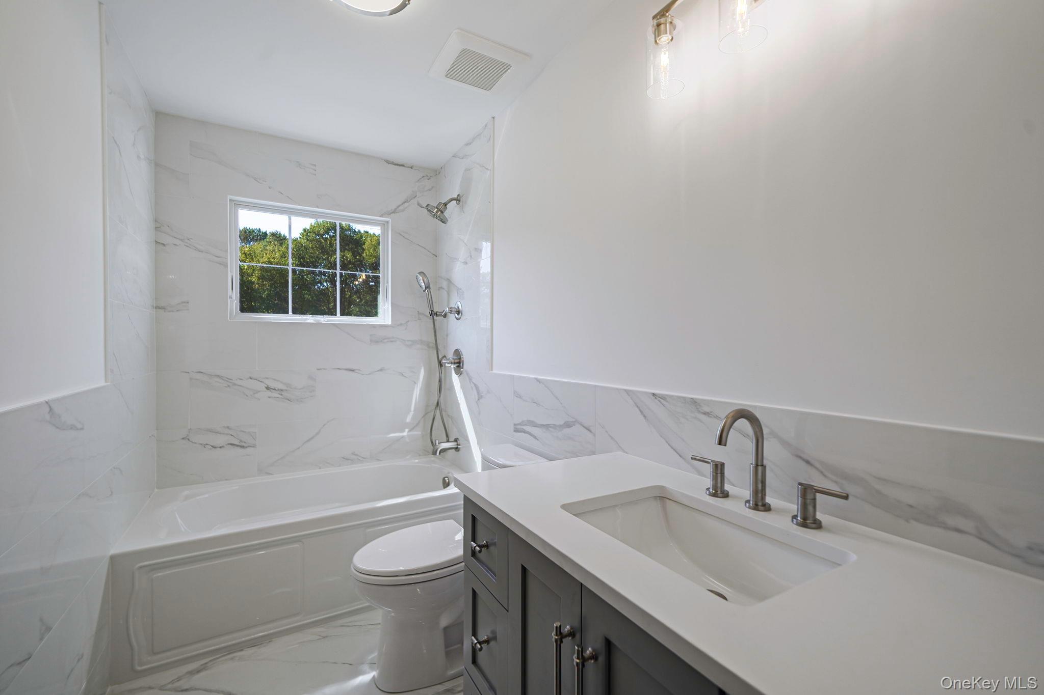 14 Quintree Lane Melville, NY 11747 - Photo 35 of 46 a bathroom with a sink toilet and shower