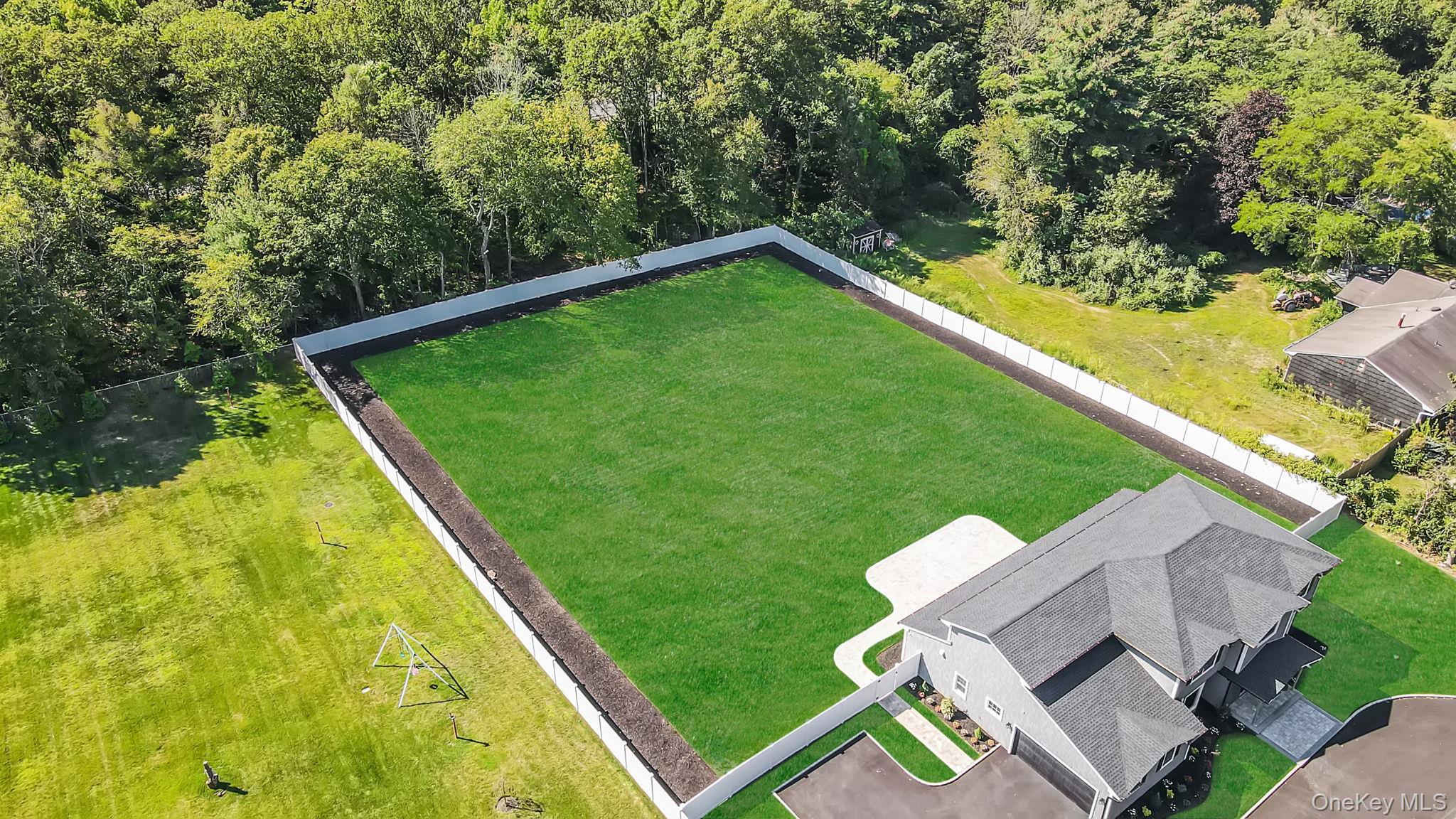 14 Quintree Lane Melville, NY 11747 - Photo 4 of 46 a view of a backyard with a small pool