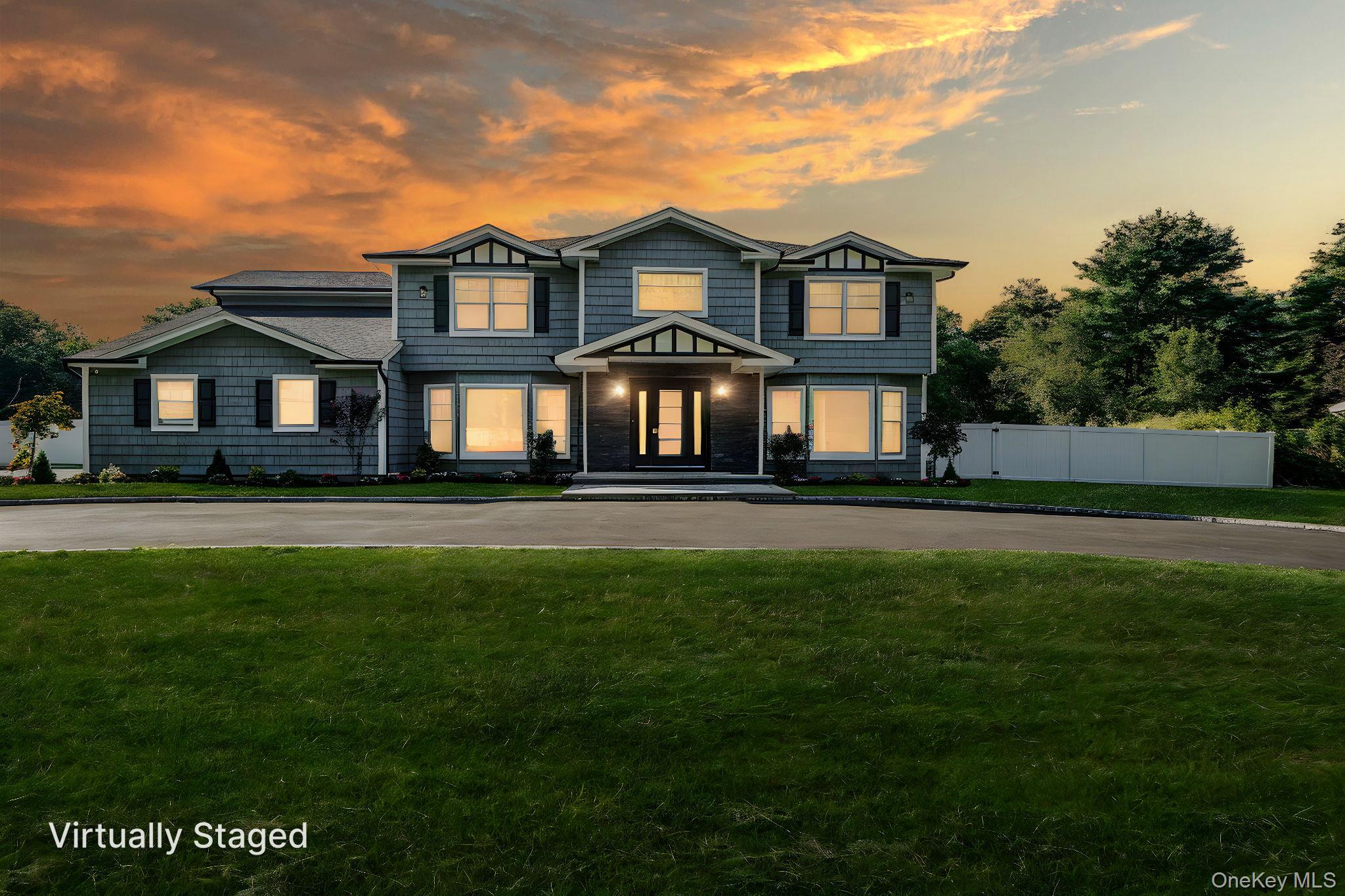 14 Quintree Lane Melville, NY 11747 - Photo 44 of 46 a front view of a house with a garden