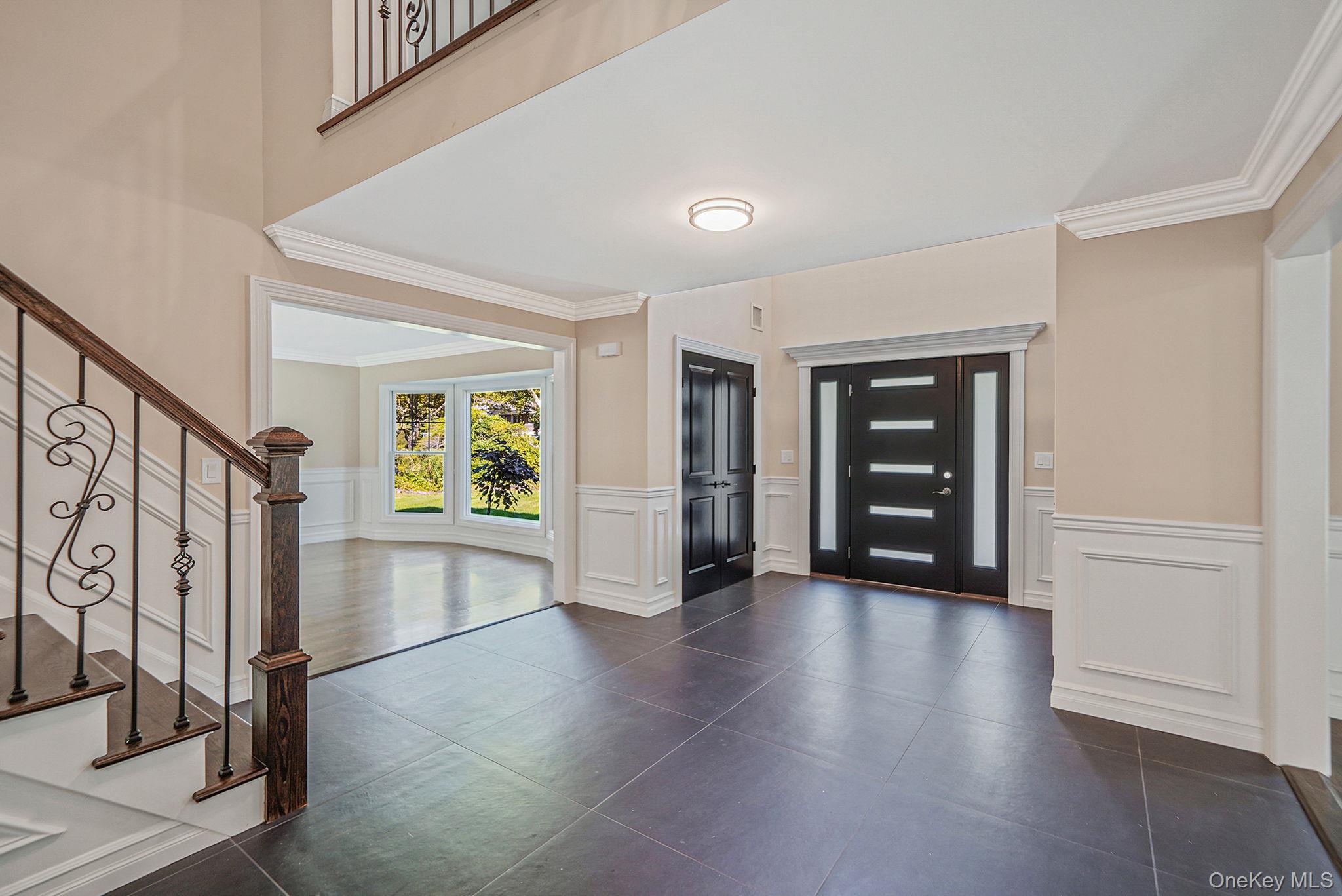 14 Quintree Lane Melville, NY 11747 - Photo 6 of 46 wooden floor with an empty room and chair