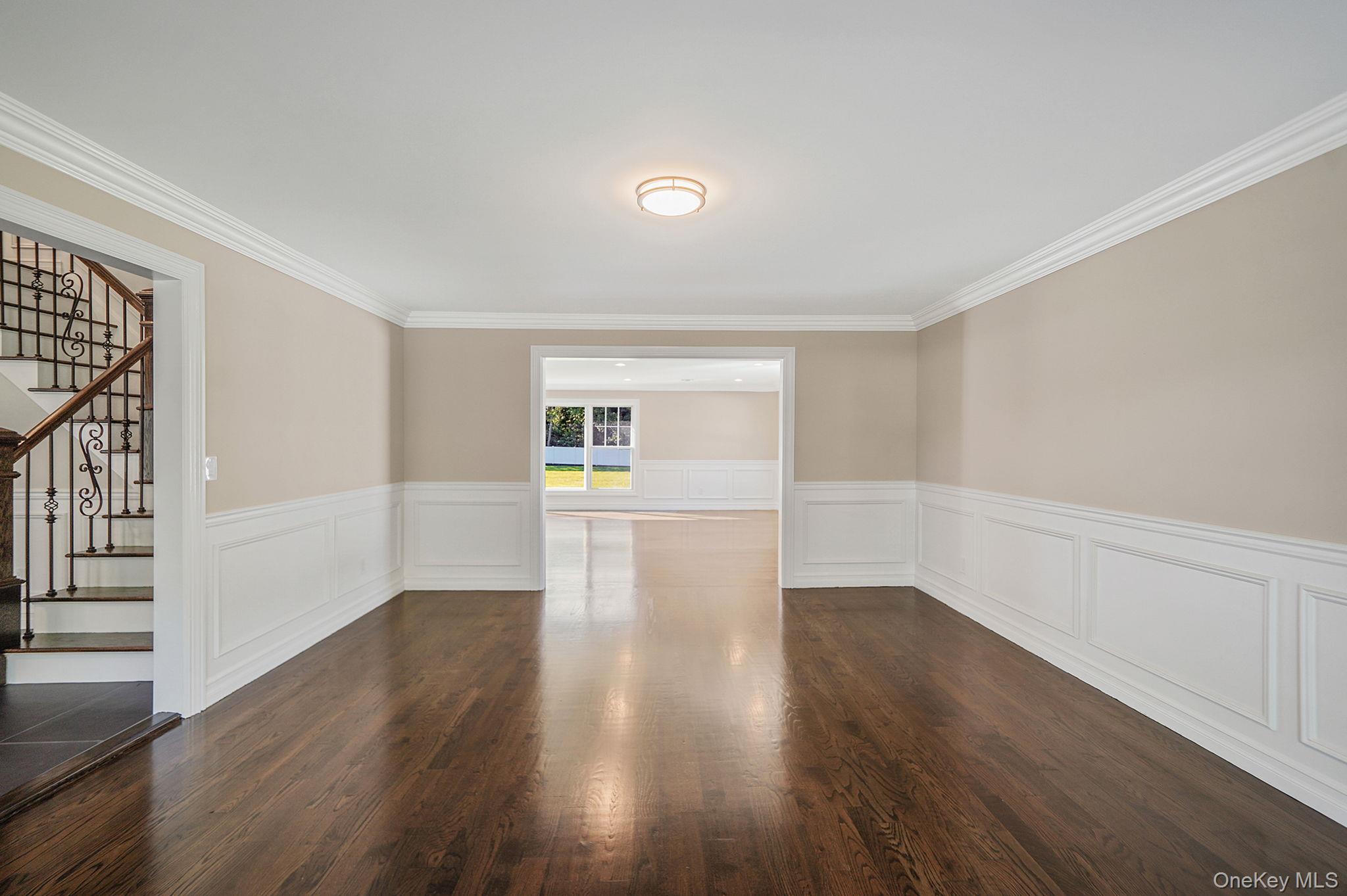 14 Quintree Lane Melville, NY 11747 - Photo 9 of 46 wooden floor in an empty room with a window