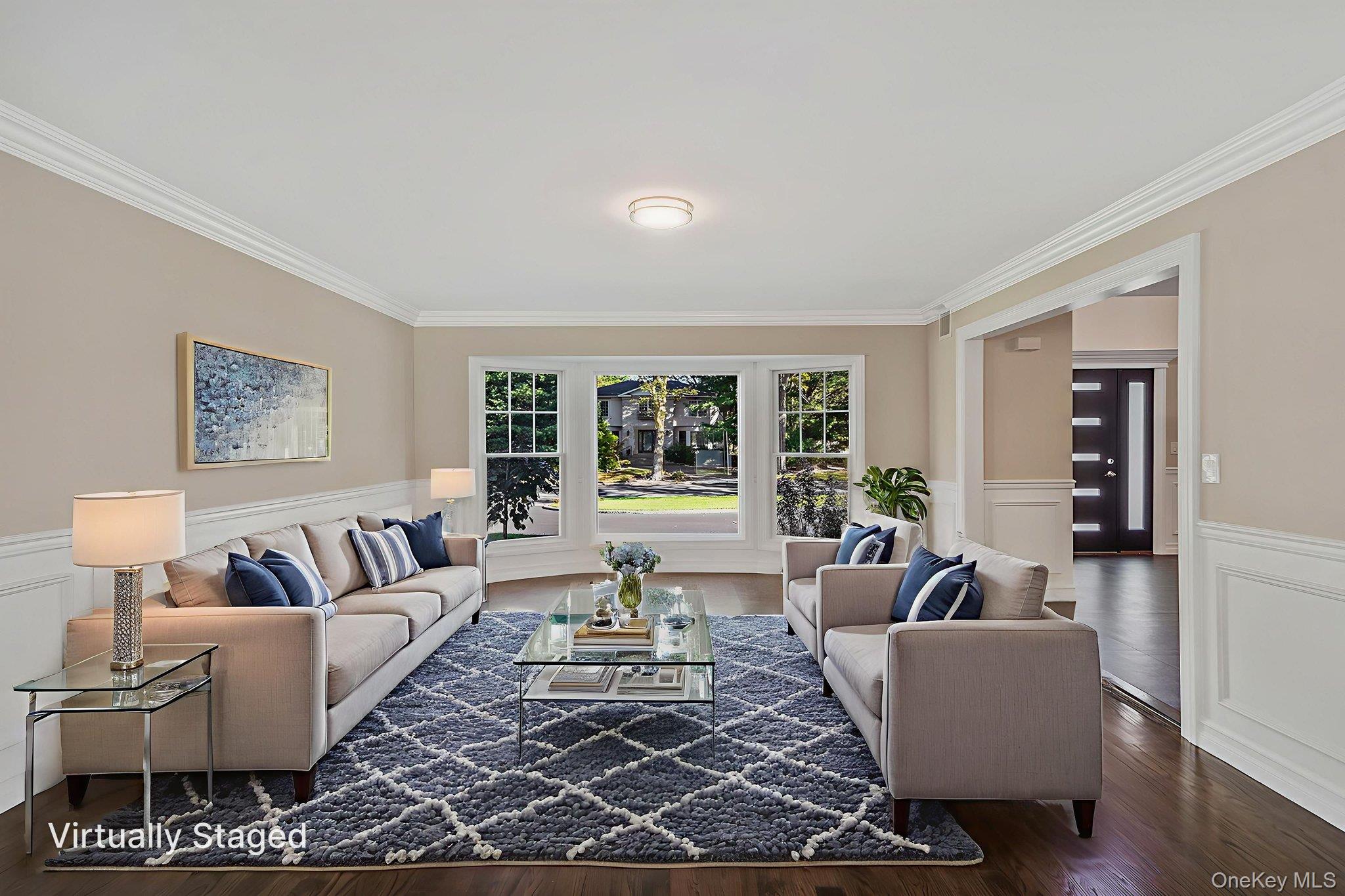 14 Quintree Lane Melville, NY 11747 - Photo 10 of 46 a living room with furniture and a large window