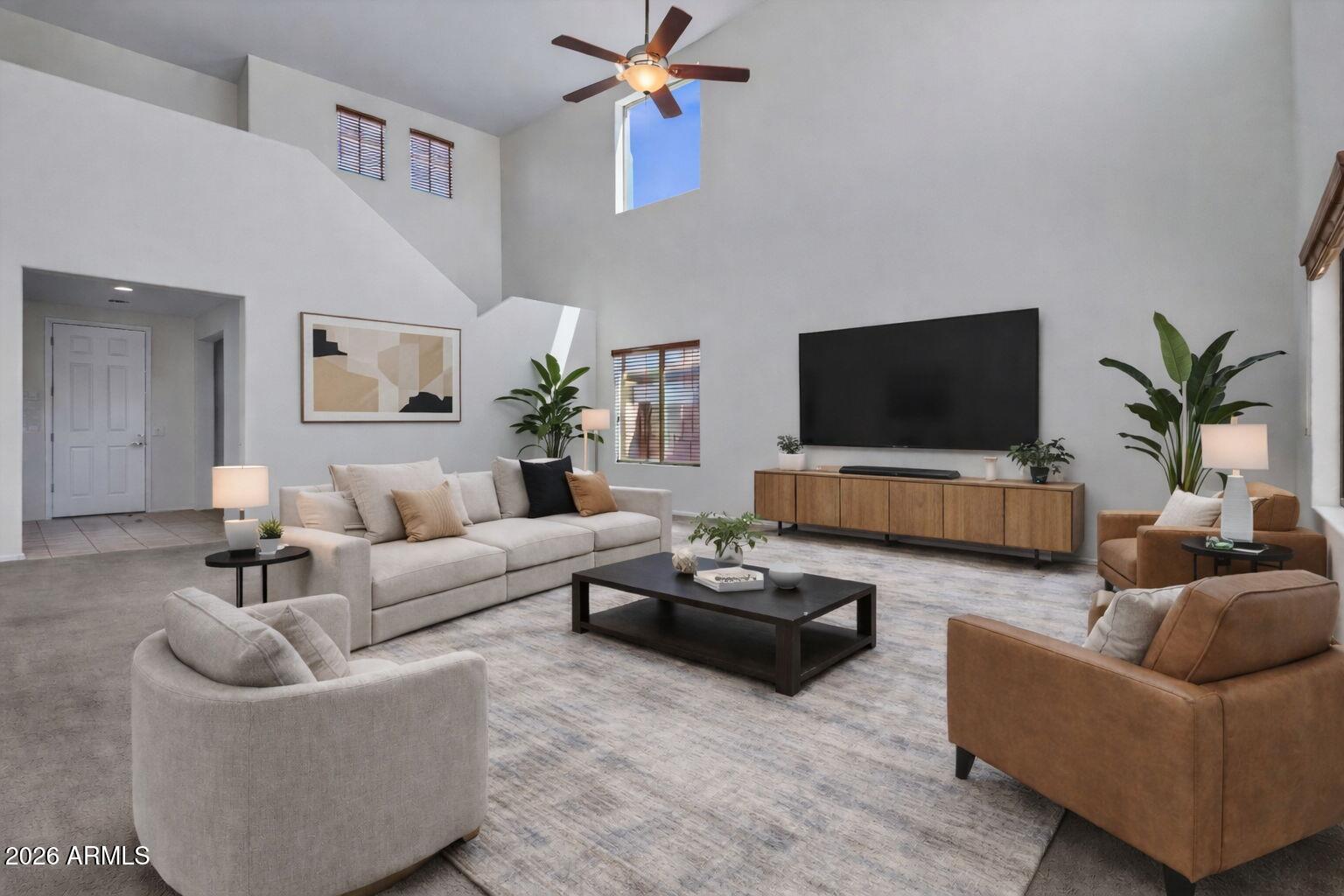 17543 West Buckhorn Trail Surprise, AZ 85387 - Photo 8 of 104 a living room with furniture and a flat screen tv