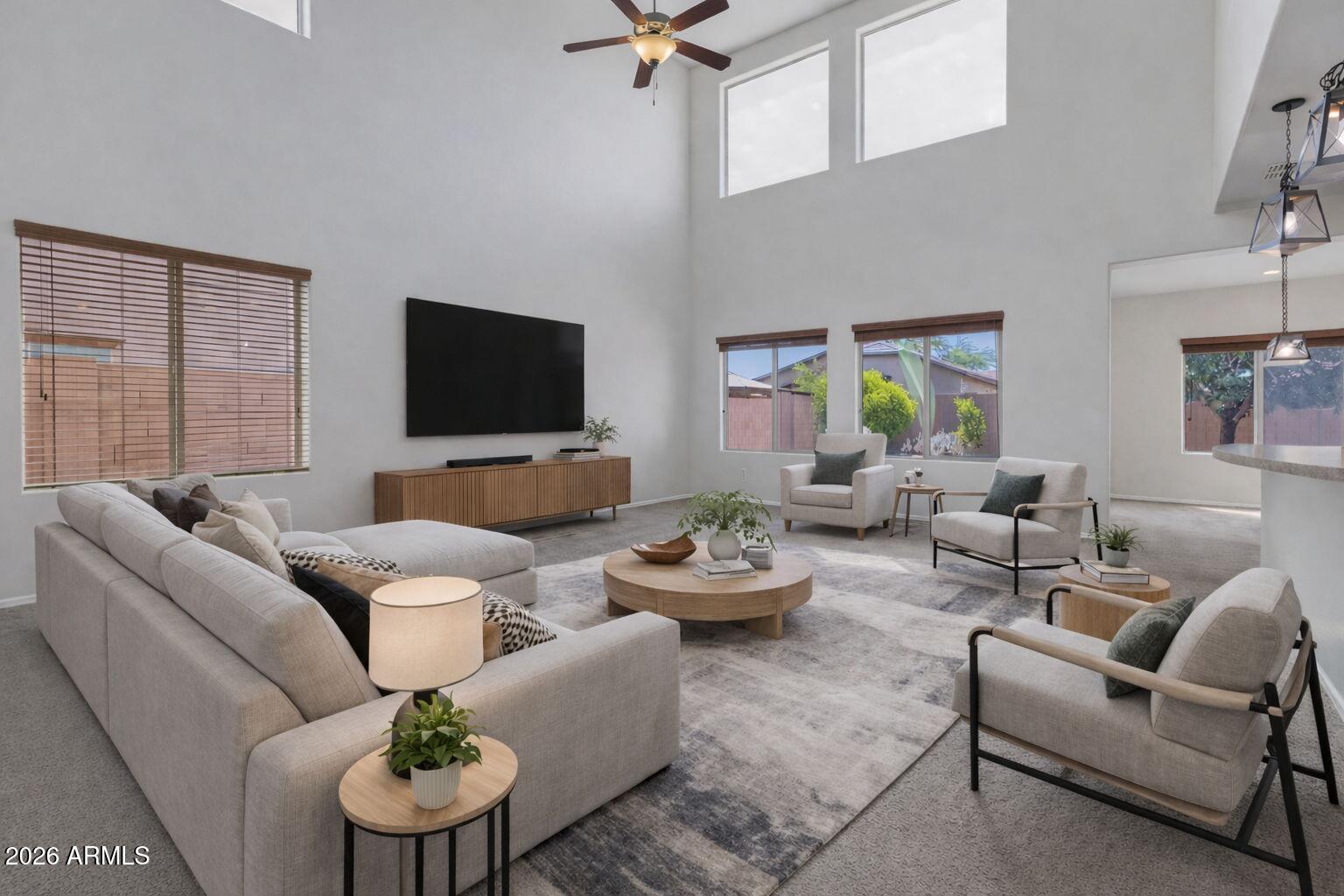 17543 West Buckhorn Trail Surprise, AZ 85387 - Photo 10 of 104 a living room with furniture kitchen view and a window
