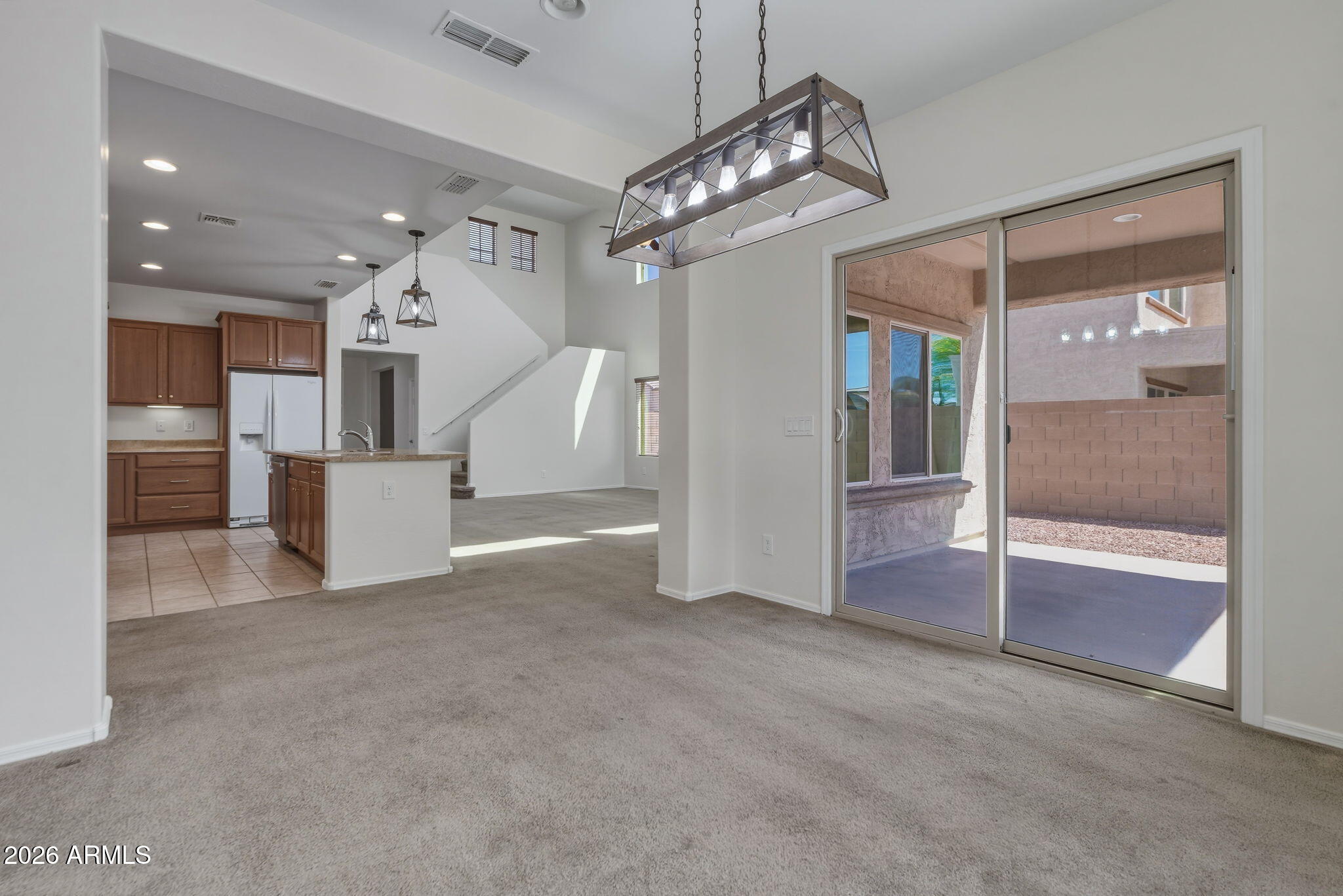 17543 West Buckhorn Trail Surprise, AZ 85387 - Photo 14 of 104 a view of a big room with a chandelier and fireplace