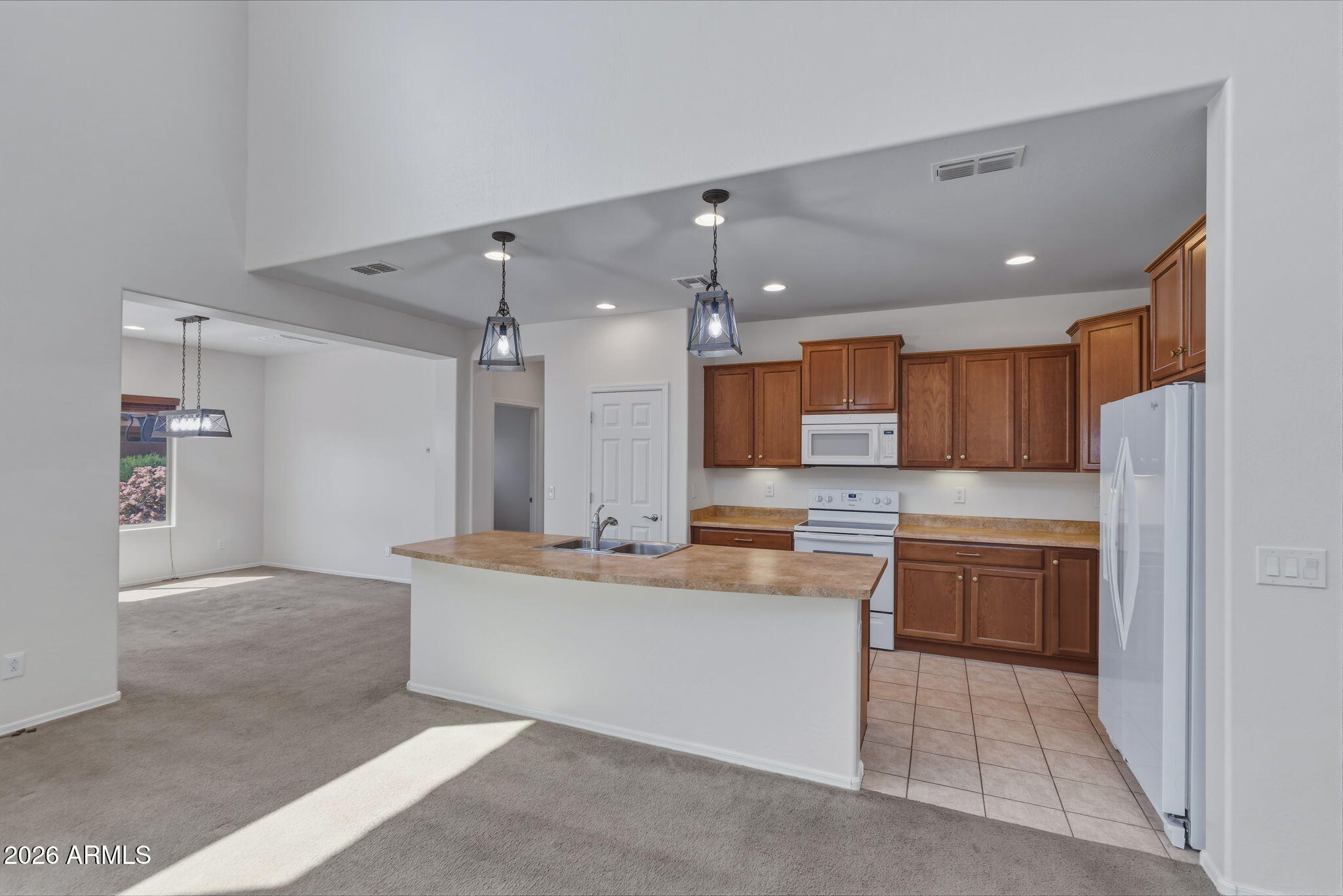 17543 West Buckhorn Trail Surprise, AZ 85387 - Photo 19 of 104 a large kitchen with cabinets and stainless steel appliances