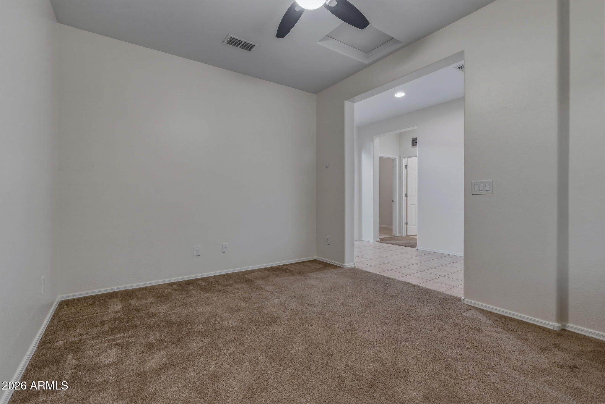 17543 West Buckhorn Trail Surprise, AZ 85387 - Photo 26 of 104 an empty room with chandelier fan and windows