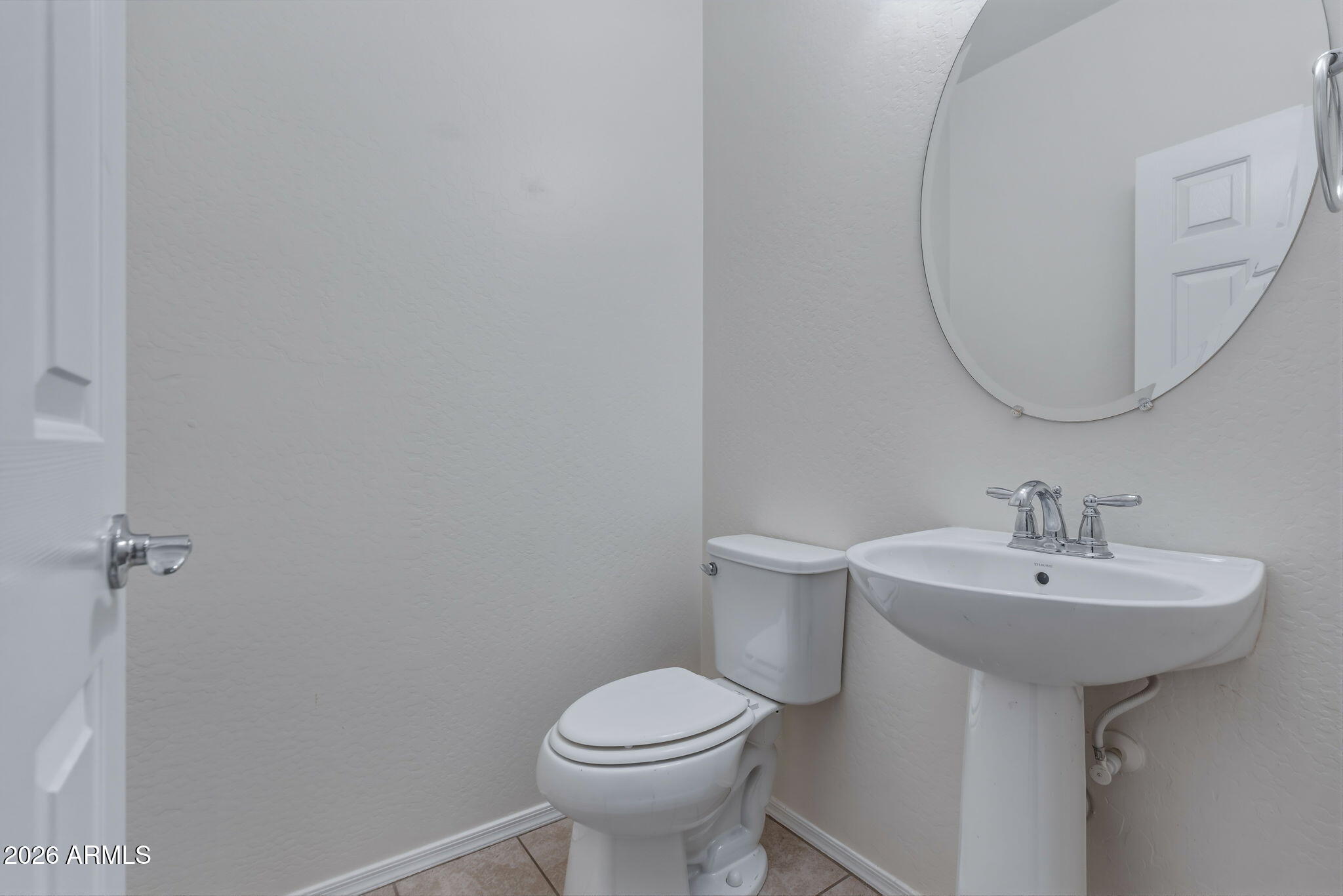 17543 West Buckhorn Trail Surprise, AZ 85387 - Photo 27 of 104 a bathroom with a sink toilet and a mirror
