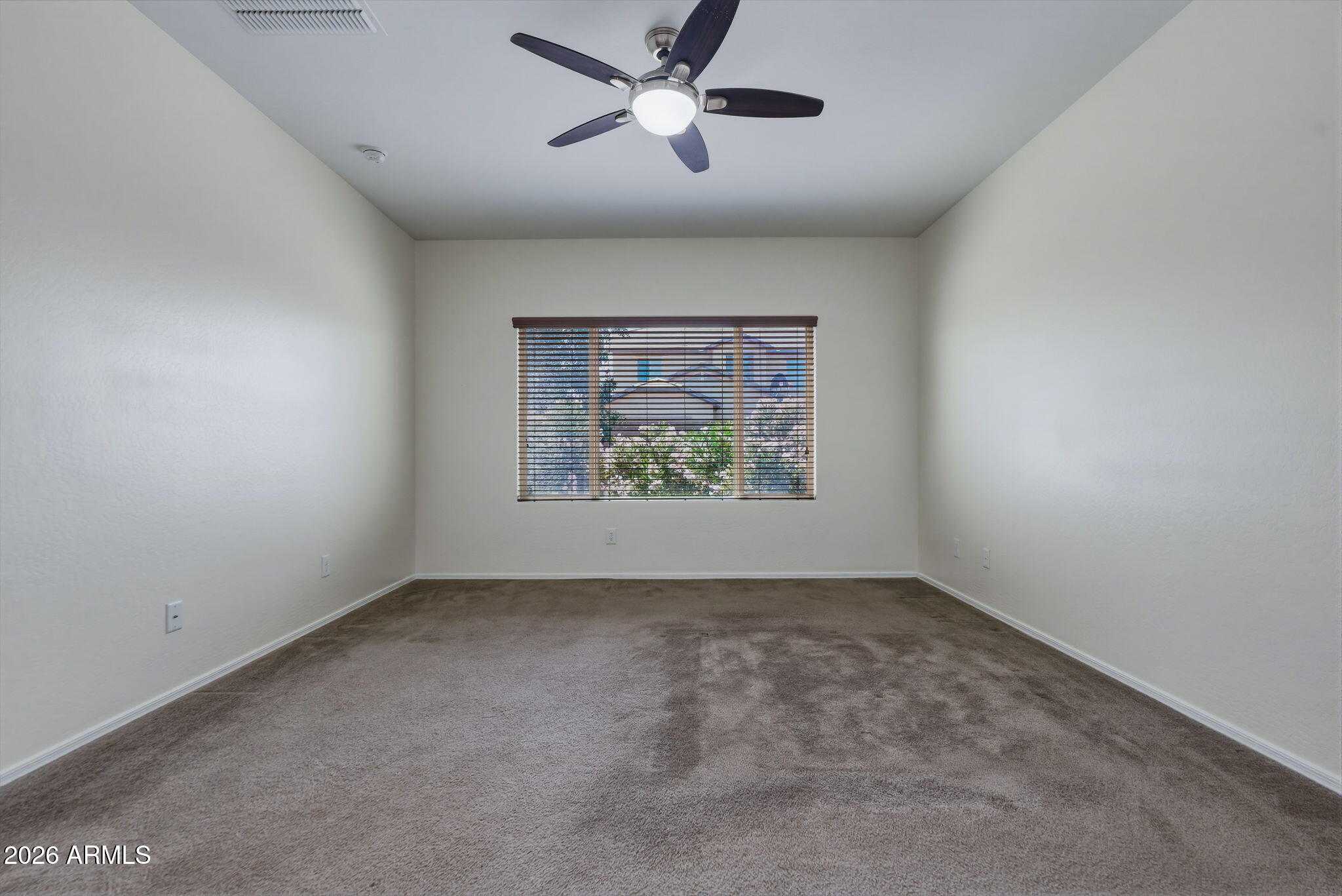 17543 West Buckhorn Trail Surprise, AZ 85387 - Photo 29 of 104 a view of an empty room with a window