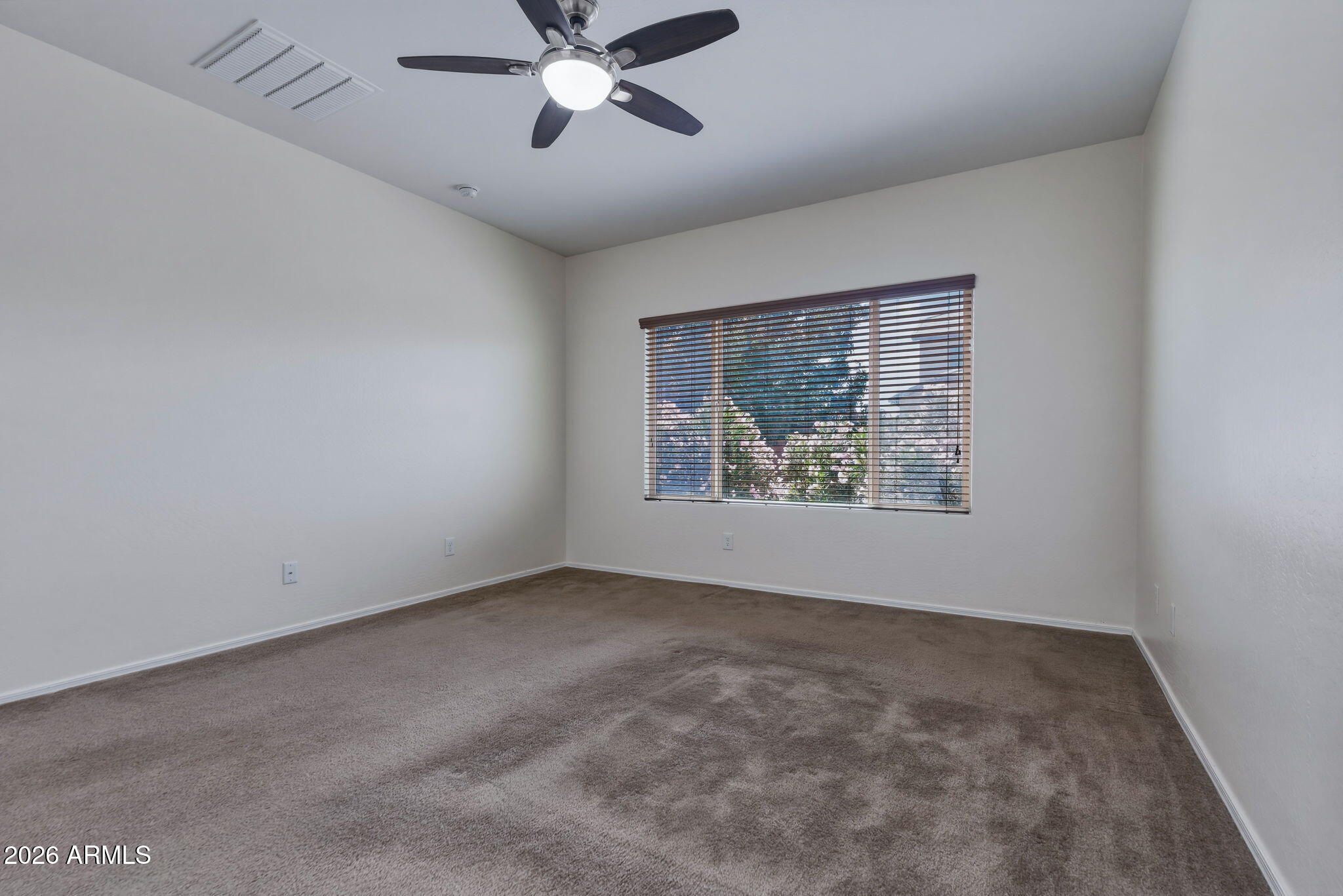 17543 West Buckhorn Trail Surprise, AZ 85387 - Photo 31 of 104 a view of an empty room with a window