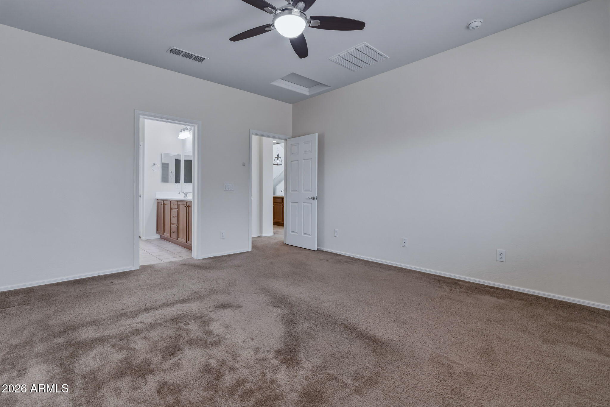 17543 West Buckhorn Trail Surprise, AZ 85387 - Photo 32 of 104 an empty room with chandelier fan and windows