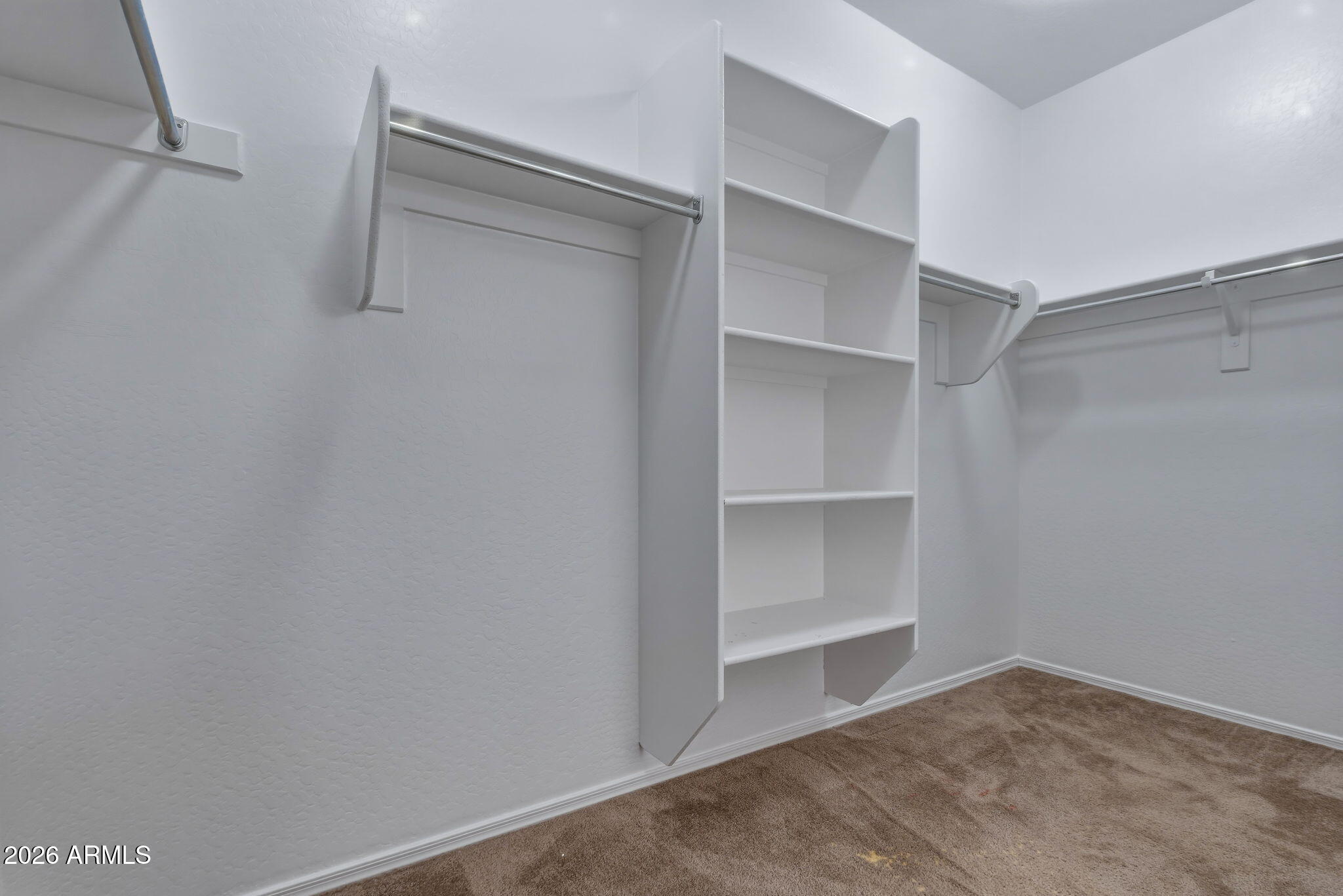 17543 West Buckhorn Trail Surprise, AZ 85387 - Photo 38 of 104 a view of an empty walk in closet