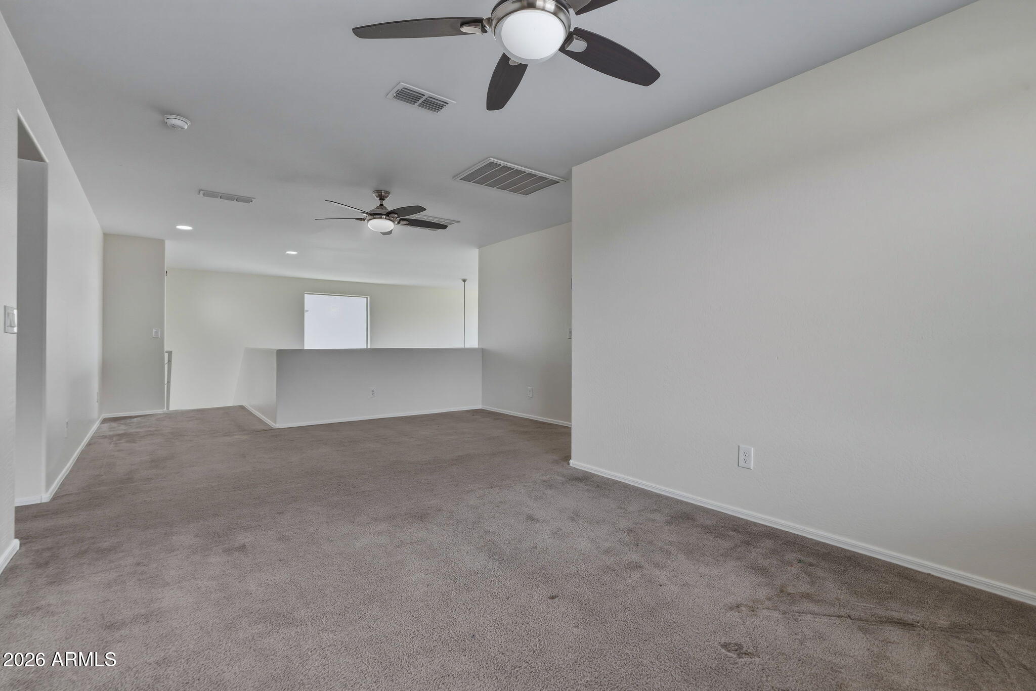 17543 West Buckhorn Trail Surprise, AZ 85387 - Photo 43 of 104 a view of an empty room with a ceiling fan