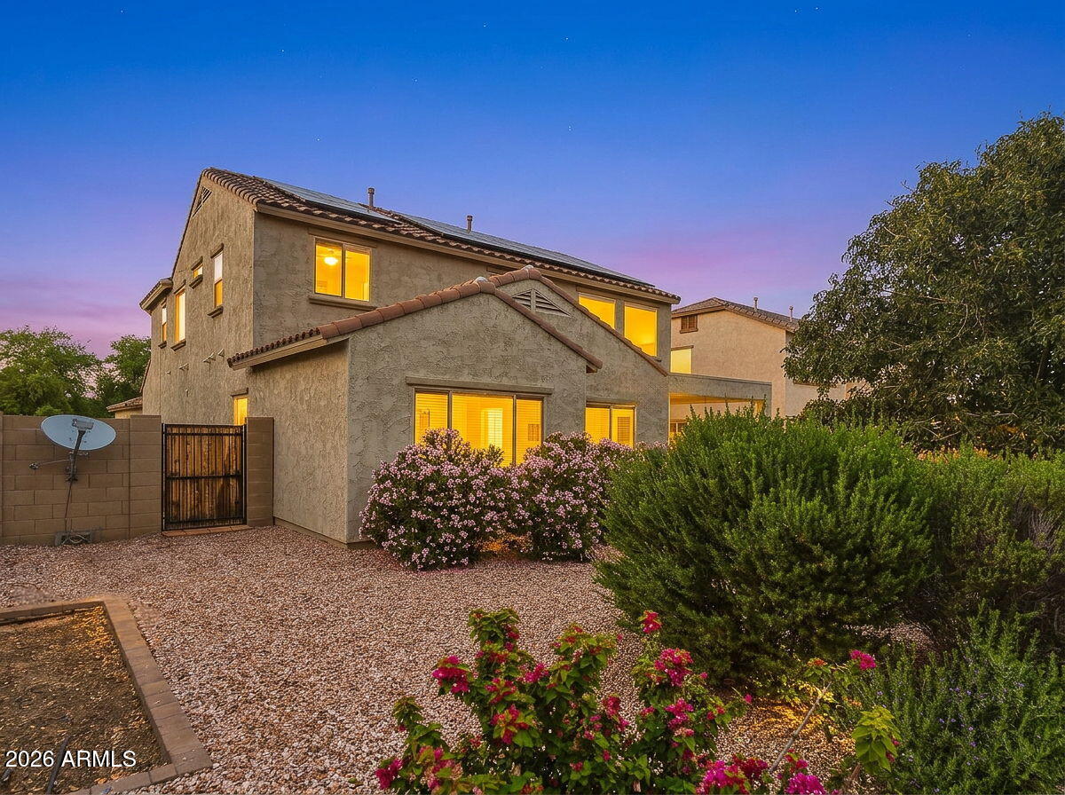 17543 West Buckhorn Trail Surprise, AZ 85387 - Photo 64 of 104 a front view of a house with a yard