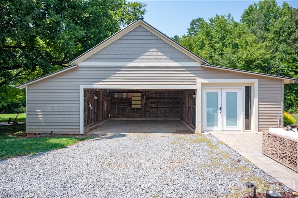 6881 Tuckaseegee Road Kannapolis, NC 28081 - Photo 14 of 34 a front view of a house with garage