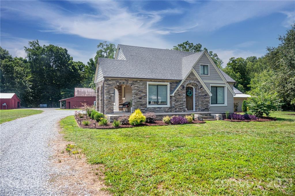 6881 Tuckaseegee Road Kannapolis, NC 28081 - Photo 22 of 34 a view of house with backyard and swimming pool
