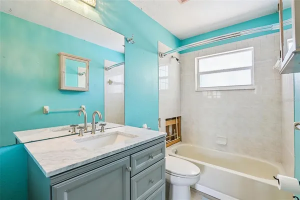 a bathroom with a sink toilet and a bathtub