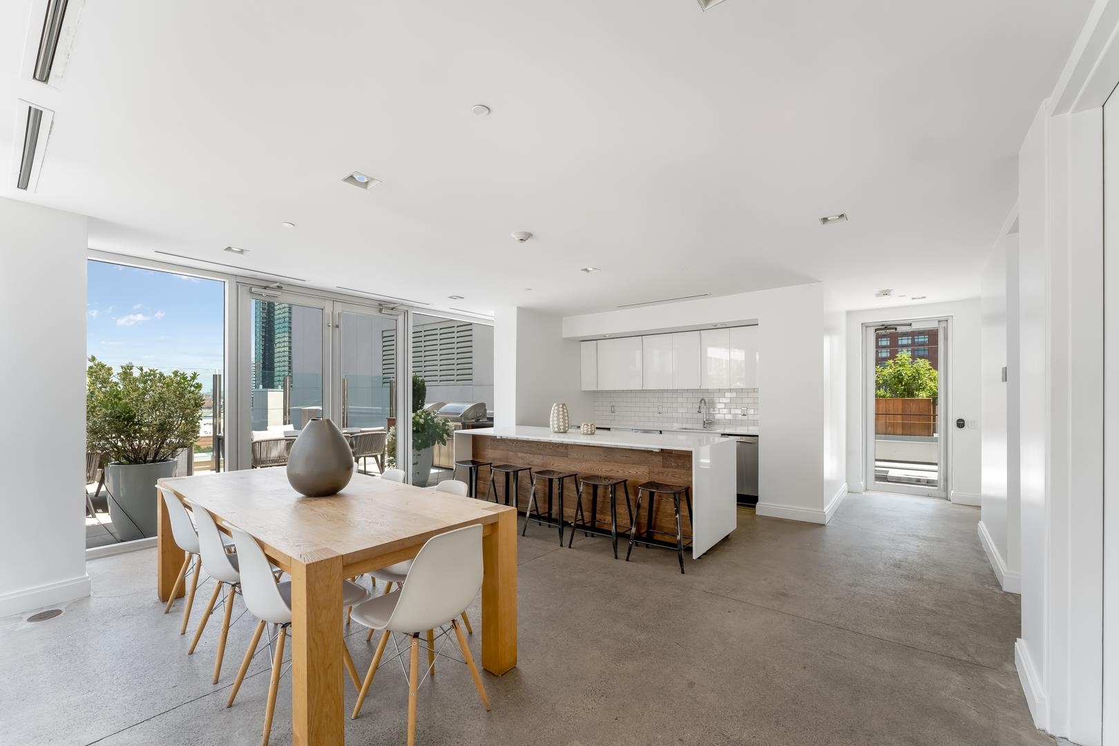 148 1st Street, Unit 809 Jersey City, NJ 07302 - Photo 11 of 20 a living room with furniture and a table
