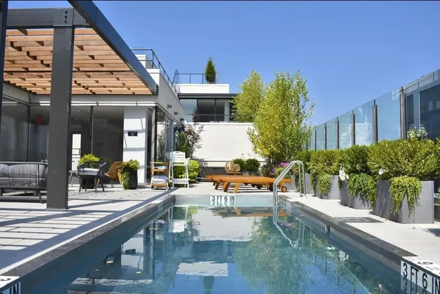 a view of a house with balcony and outdoor space