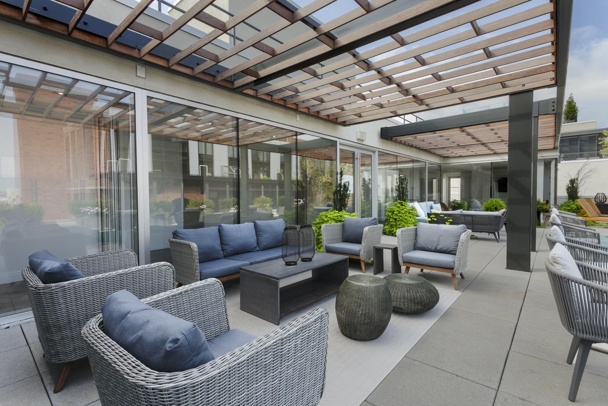 148 1st Street, Unit 809 Jersey City, NJ 07302 - Photo 7 of 20 a living room with furniture and a large window