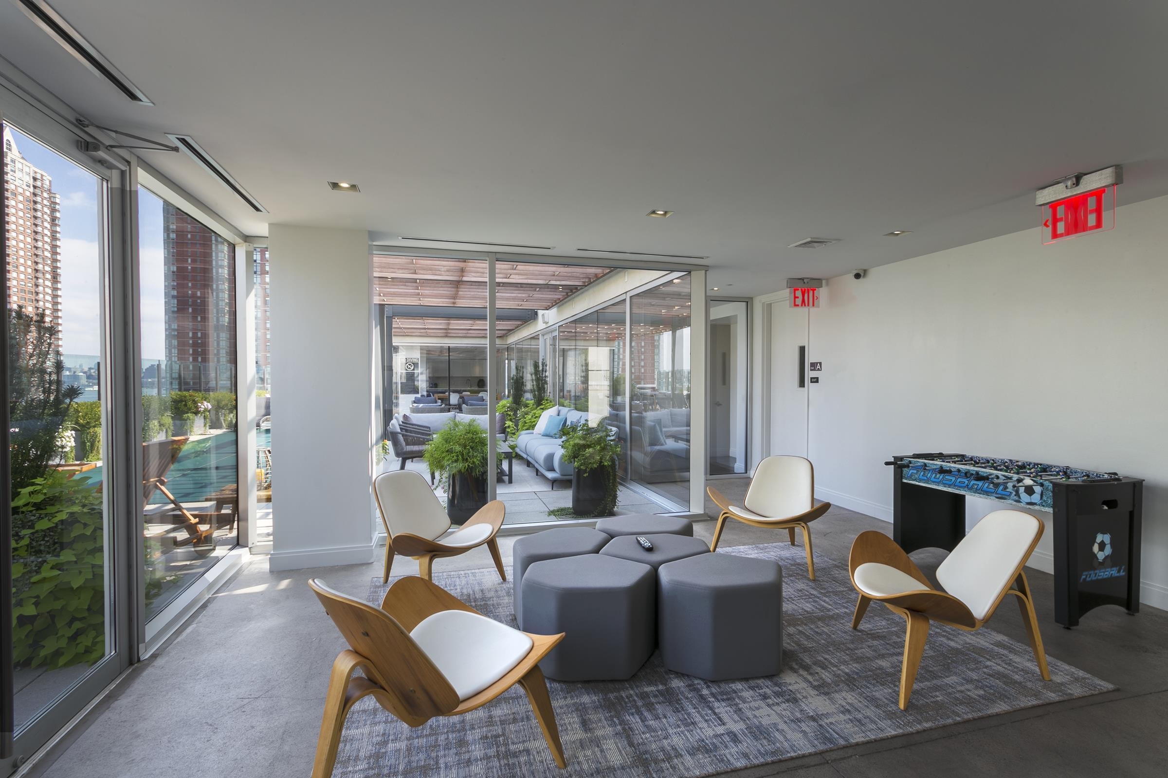 148 1st Street, Unit 809 Jersey City, NJ 07302 - Photo 9 of 20 a living room with furniture and a potted plant