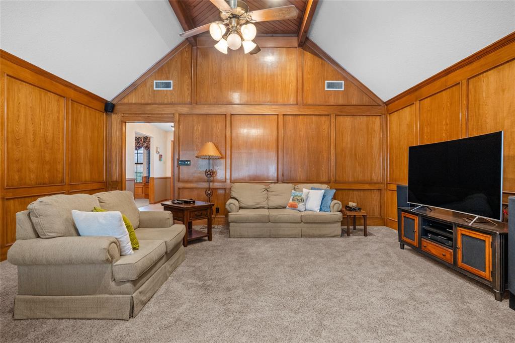 5840 Crystal Drive Midlothian, TX 76065 - Photo 6 of 36 a living room with furniture and a flat screen tv