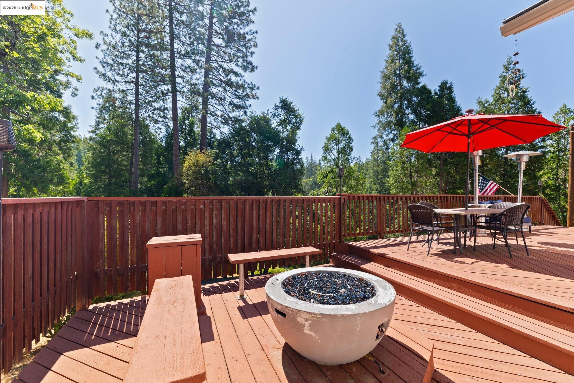 18080 Little Fuller Road Twain Harte, CA 95383 - Photo 38 of 40 Wooden terrace featuring outdoor dining area and an outdoor fire pit
